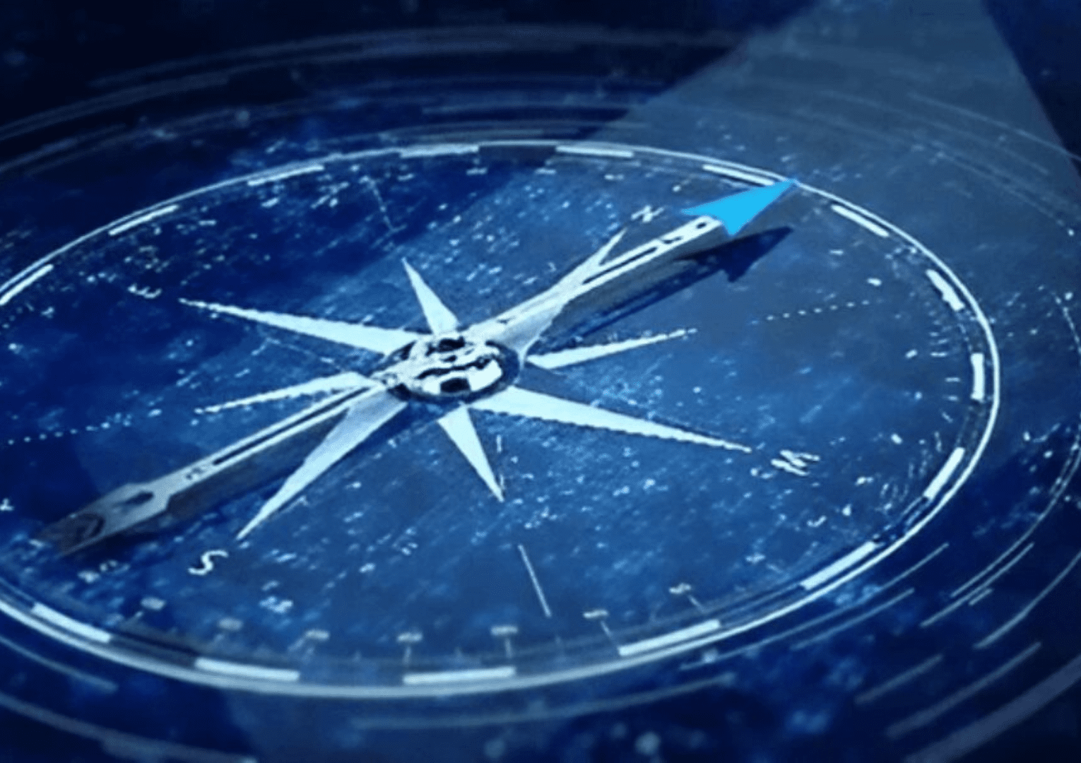 A close up view of a compass in blue color1